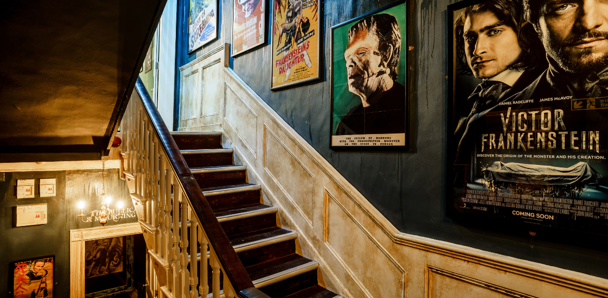 Frankenstein posters and staircase inside Mary Shelley's